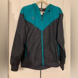 Vintage Y2K Umbro Teal and Gray Hooded Windbreaker
Size Medium Unisex